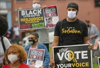  ?? Steve Mellon/ Post- Gazette ?? Philip Greene, of Churchill, joined dozens of others at a news conference organized by the Black Political Empowermen­t Project on Wiley Avenue in the Hill District on Thursday.