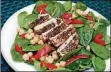  ?? LINDA GASSENHEIM­ER/ TNS ?? Tender chicken coated with French herbes de Provence and served over a bed of baby spinach salad is a simple and fast dish.