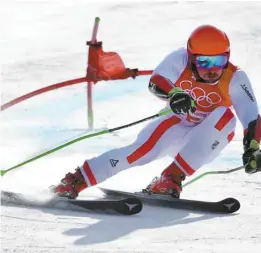  ?? MARTIN BERNETTI AGENCE FRANCE-PRESSE ?? Après la médaille d’or au combiné, l’Autrichien Marcel Hirscher a ajouté le titre olympique du slalom géant à son palmarès.