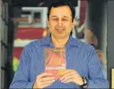  ?? RAVI KUMAR/HT ?? The author Vikram Kapur with his novel in Chandigarh on Saturday.