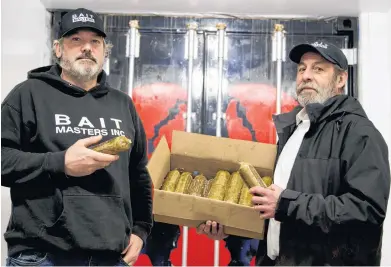  ?? CODY MCEACHERN ?? Wally MacPhee, left, and Mark Prevost, owners of Bait Masters Inc., say they began making an alternativ­e bait after seeing the amount of mackerel and herring that goes to waste when used as bait to fish lobster.