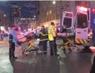  ?? CHRIS PORTER/GETTY IMAGES ?? EMT and Police give first aid to a shooting victim in downtown on Wednesday in Seattle.