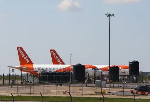  ?? SOPA Images/ Dinendra Haria / SOPA Images ?? EasyJet aircrafts at Luton airport.