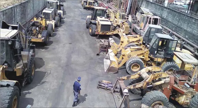  ??  ?? Broken down tractors and machinery in Apapa, Lagos; awaiting NIRSAL, MECA planned interventi­on