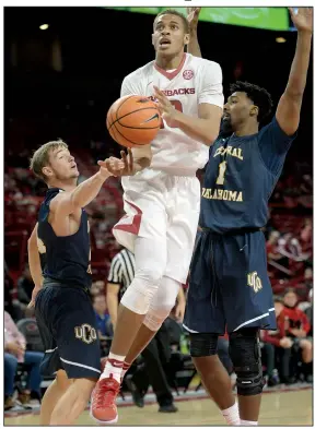  ?? NWA Democrat-Gazette/ANDY SHUPE ?? Arkansas freshman Daniel Gafford of El Dorado will make his college debut tonight when the Razorbacks host Samford. Gafford, who chose the No. 10 for his jersey number, said there is some pressure to live up to the standards set by previous Razorbacks...