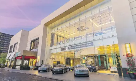  ??  ?? The Rolls-Royce showroom at The Post Oak Hotel in Houston features a massive chandelier and impressive lighting to highlight the half-million-dollar cars. Below, homes can be rented for full driving weekends in Alton, Va. The track is so close, guests can watch from their balconies.