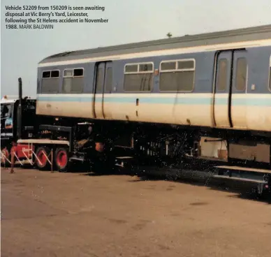  ?? MARK BALDWIN ?? Vehicle 52209 from 150209 is seen awaiting disposal at Vic Berry’s Yard, Leicester, following the St Helens accident in November 1988.