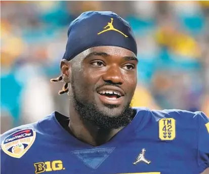  ?? REBECCA BLACKWELL/AP ?? Linebacker David Ojabo was expected to be a mid-first-round pick before he tore his Achilles tendon at Michigan’s pro day, an injury that’s expected to delay his NFL debut. Instead, he fell to Baltimore in the middle of the second round.