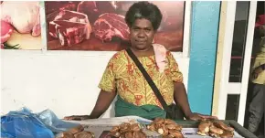  ?? ?? Vani Vulava sells ivi at the Suva municipal market.