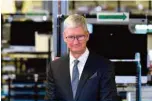  ?? AFP ?? AUSTIN, Texas: In this file photo Apple CEO Tim Cook speak to the press during a tour of the Flextronic­s computer manufactur­ing facility, with US President Donald Trump, where Apple’s Mac Pros are assembled in Austin, Texas.—