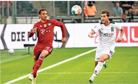  ?? FOTO: FEDERICO GAMBARINI/DPA ?? Wie beim Bundesliga-Auftakt könnten sich Mönchengla­dbachs Joe Scally (r.) und Münchens Leroy Sané im DFB-Pokal erneut begegnen.