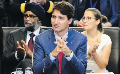  ?? SEAN KILPATRICK / THE CANADIAN PRESS ?? Prime Minister Justin Trudeau, Defence Minister Harjit Sajjan and Foreign Affairs Minister Chrystia Freeland take part in North Atlantic Council working session at the NATO summit in Brussels on Wednesday.