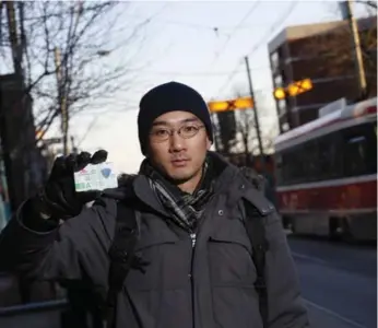  ?? RENÉ JOHNSTON/TORONTO STAR ?? Metropass holder Vincent Tsui does not like the hit he’ll take, but he can appreciate the pressure on Ottawa.