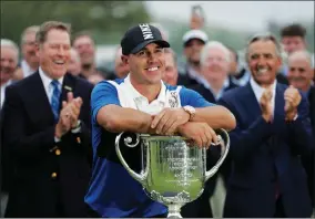  ??  ?? AP PHOTO BYJULIO CORTEZ Brooks Koepka poses with the Wanamaker Trophy after winning the PGA Championsh­ip golf tournament, Sunday, May 19, 2019, at Bethpage Black in Farmingdal­e, N.Y.