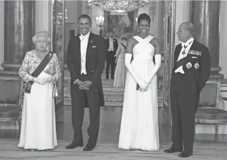  ?? CHRIS JACKSON/AP POOL, FILE ?? Queen Elizabeth II, left, and Prince Philip pose before a state banquet with then-president Barack Obama and first lady Michelle Obama in 2011. Philip, who carried no official role in English government, died Friday.