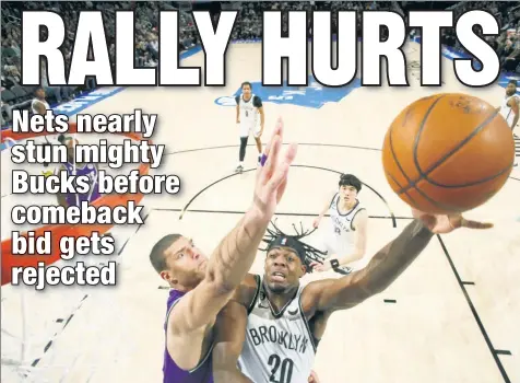  ?? Getty Images ?? BLOCK PARTY: Former Net Brook Lopez, who had a career-high nine blocks Thursday night, challenges a shot by Day’Ron Sharpe as the Bucks held off a late rally for a 118-113 victory.