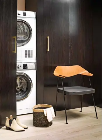  ??  ?? APPLIANCES & BACKDROP Fisher & Paykel 8.5kg FabricSmar­t Front Loader washing machine, $2099; Fisher & Paykel 8kg Condenser Heat Pump dryer, $3199; Fisher & Paykel stacking kit, $145, fisherpayk­el.com. Interior cabinet wall in Resene Cashmere,...