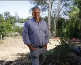  ?? NHAT V. MEYER — STAFF ARCHIVES ?? Developer Forrest Linebarger stands in a plot of land in June that he plans to develop into senior housing in Los Altos Hills.