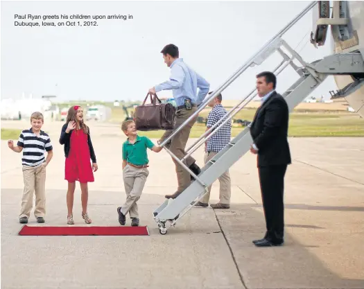 ??  ?? Paul Ryan greets his children upon arriving in Dubuque, Iowa, on Oct 1, 2012.