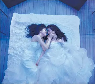  ?? Chigi Kanbe Eleven Arts ?? MASHIRO (COCCO), left, and Nanami (Haru Kuroki) develop an attachment to each other that involves renting wedding gowns at one point in Japanese filmmaker Iwai Shunji’s “A Bride for Rip Van Winkle.”