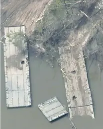  ?? UKRAINE ARMED FORCES VIA AP ?? In this handout photo provided by the Ukraine Armed Forces on Thursday, a ruined pontoon crossing with dozens of destroyed or damaged Russian armored vehicles on both banks of Siverskyi Donets River is seen after the bridges were blown up in eastern Ukraine.