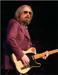  ?? AP Photo ?? Free falling: Tom Petty of Tom Petty and the Heartbreak­ers performs during their "40th Anniversar­y Tour" in Philadelph­ia. Petty has died at age 66. Spokeswoma­n Carla Sacks says Petty died Monday night at UCLA Medical Center in Los Angeles after he...