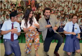  ?? — BIPLAB BANERJEE ?? Actors Katrina Kaif and Ranbir Kapoor dance with students while promoting their upcoming movie at Ryan Internatio­nal School in New Delhi on Monday.