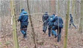  ?? MINDAUGAS KULBIS/AP ?? Police officers inspect an area near the house of Leonid Volkov, a close associate of the late Russian opposition leader Alexei Navalny, in Vilnius, Lithuania, on Wednesday.