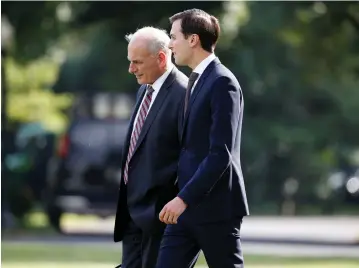  ?? (Reuters) ?? WHITE HOUSE Chief of Staff John Kelly and Senior White House Adviser Jared Kushner walk to Marine One at the White House in Washington last week.