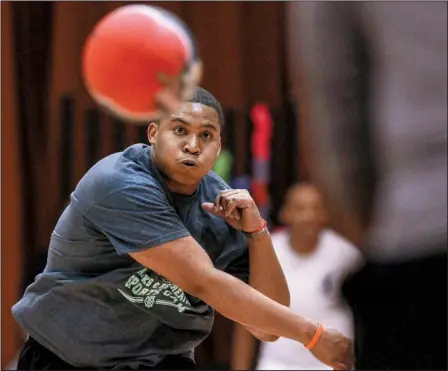  ?? Arkansas Democrat-Gazette/BENJAMIN KRAIN ?? Taydrick Willis of team PU unleashes a mighty throw during a game in North Little Rock Parks and Recreation’s Adult Dodgeball League.