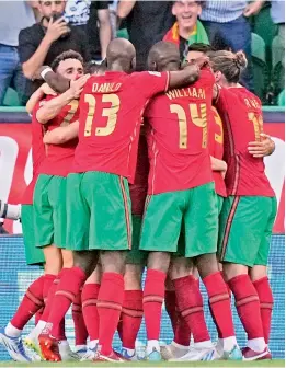  ?? — AP ?? Portugal’s Gonçalo Guedes celebrates with his teammates after scoring against the Czech Republic during their UEFA Nations League match at the Jose Alvalade Stadium in Lisbon on Thursday. Portugal won 2-0.