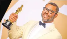  ??  ?? JORDAN PEELE IS THE fiRST BLACK WRITER TO WIN AN OSCAR FOR BEST ORIGINAL SCREENPLAY FOR “GET OUT.”