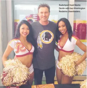 ??  ?? RadioSport host Martin Devlin with two Washington Redskins cheerleade­rs.