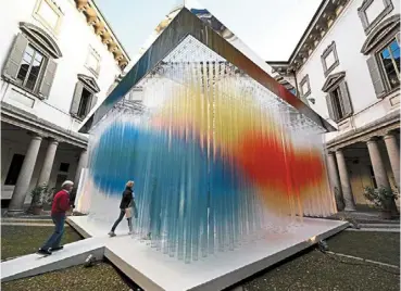  ?? —afp ?? Kaleidosco­pic: Visitors looking at the artwork ‘straordina­ria’, an immersive installati­on presented by the italian company Elica, on the eve of the Milan design Week, in Milan, italy.