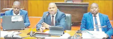  ?? ?? Chairman of the Public Accounts Committee (PAC) Musa Kunene flanked by the Auditor General Timothy Matsebula (R) and Parliament Secretary Arthur Mordaunt during one of the committee’s sittings in this file pic.