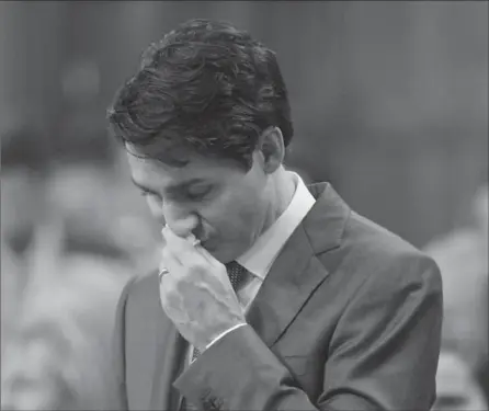  ?? ADRIAN WYLD, THE CANADIAN PRESS ?? In the House of Commons, Prime Minister Justin Trudeau pauses while making a formal apology to individual­s harmed by federal legislatio­n, policies and practices that led to discrimina­tion against LGBTQ2 people.