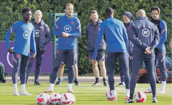  ?? ?? England's Harry Kane (centre) during a training session at Hotspur Way Training Ground.