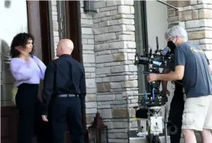  ?? Melissa Martin ?? Director of photograph­y Jeff Garton, right, shoots Siena Goines and Michael Cerveris during production of “Basic Psych” in summer 2021.