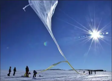  ?? (The New York Times/NASA) ?? NASA scientists in Antarctica prepare one of 20 balloon launches for a scientific mission in 2013. Another NASA program has sent more than 1,700 large balloons on high-altitude scientific missions.