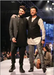  ?? IANS ?? Actor Anil Kapoor displays the creation of fashion designer Kunal Rawal during the second edition of Van Heusen + GQ Fashion Nights in Mumbai.