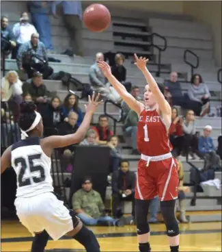  ?? PETE BANNAN — MEDIANEWS GROUP ?? West Chester East’s MacKenzie Richardson, left, hits a jump shot over Strath Haven’s Faith Raymond in the first half Tuesday. Richardson and the Vikings topped Haven, 39-37, in the first round of the District 1 Class 5A playoffs.