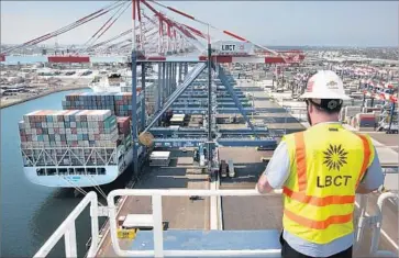 ?? Rick Loomis Los Angeles Times ?? THE ZERO-EMISSIONS plan unveiled by the ports of L.A. and Long Beach sends a message to manufactur­ers that there will be a market for clean air equipment, experts say. Above, a ship is unloaded in Long Beach.