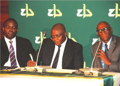  ??  ?? ZB Financial Holdings senior executives (from left) Mr Mike Manyika, group chief operating officer; Mr Fanuel Kapanje, group finance director; and Mr Ronald Mutandagay­i, group chief executive officer, pitch questions at an analyst briefing held in the...