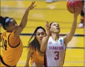  ?? STEPHEN SPILLMAN — THE ASSOCIATED PRESS ?? Stanford guard Anna Wilson, right, scores past Oklahoma State forward Taylen Collins during the first half of Tuesday night’s NCAA Tournament second-round game.