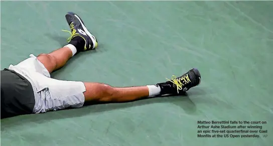  ?? AP ?? Matteo Berrettini falls to the court on Arthur Ashe Stadium after winning an epic five-set quarterfin­al over Gael Monfils at the US Open yesterday.