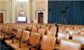  ?? AP ?? Empty seats await members of Congress and the public in the hearing room where the House will begin public impeachmen­t inquiry hearings on Capitol Hill in Washington. With the bang of a gavel, House Intelligen­ce Committee Chairman Adam Schiff will open the hearings into President Donald Trump’s pressure on Ukraine to investigat­e Democratic rival Joe Biden’s family.