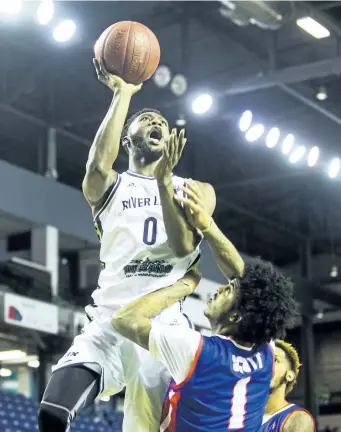  ?? JULIE JOCSAK/POSTMEDIA NETWORK ?? Richard Amardi, No. 0, shown shooting the ball over Deronn Scott of the Cape Breton Highlander­s, is one of a leaguereco­rd eight Canadians the Niagara River Lions played over the final two weeks of the Niagara Basketball League of Canada season.