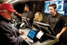  ?? AP PHOTO/WAYNE PARRY ?? A customer makes a sports bet at Resorts Casino in Atlantic City, New Jersey.