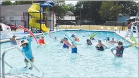  ?? Westside Eagle Observer/SUSAN HOLLAND ?? Elsie Mucci (left front), of Gravette, leads participan­ts in her class of water aerobics Friday, July 22, at the Gravette pool. There is no charge for the classes held from 10 to 11 a.m. Monday, Wednesday and Friday. They will continue until the pool closes for the season.