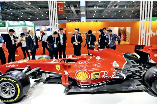  ??  ?? A Ferrari sports car on display at the Italian pavilion of the first China Internatio­nal Import Expo (CIIE) in November 2018.